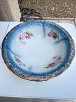 Top view of entire charger showing floral design and border