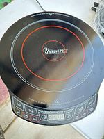 Top view of NuWave Precision Induction Cooktop Pro showing control panel and cooking surface
