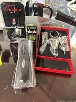 All items grouped: Rabbit aerator, Cork Pops refills, electric opener, red gift box with accessories