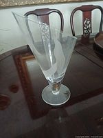 Full view of clear glass vase on table