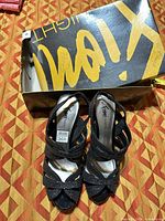 Pair of black Fioni strappy sandals size 8 with shoebox visible