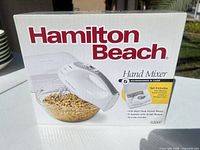 Front of sealed box showing image and specifications