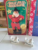 Boxed Holly Jolly Rock Santa with ceramic sleigh shakers