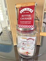 Front view of Kilner butter churn with product tag attached