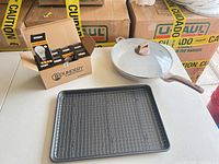 Entire lot: frying pan with lid, baking sheet, cooling rack, boxed LED bulbs
