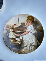 Front view of the Cora's Recital collector plate showing complete artwork and condition