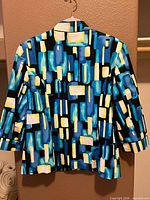 Back view of geometric print blazer