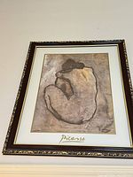 Front view of framed Picasso print on wall