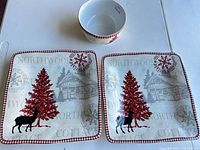 Two square plates and one bowl showing full pattern