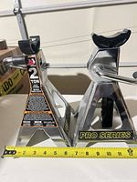 Two chrome Pro Series jack stands side by side with tape measure showing scale