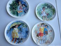 Front view of all four Paul Durand illustrated plates