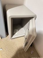 Front view of small light grey fire safe, door open showing interior
