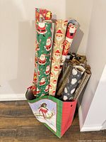 Bag containing multiple rolls of assorted wrapping paper