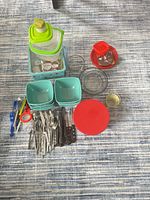 All items laid out including bowls, containers, flatware and utensils