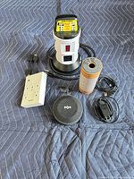 All items grouped: speaker, power tower, wall charger, cables