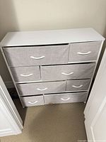 Front view of dresser showing all eight fabric drawers