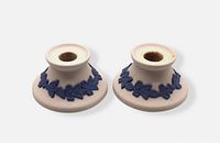 Pair of white stoneware candleholders front view