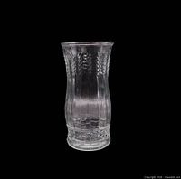 full view of clear pressed glass vase with wheat motif