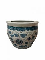 Front view showing blue floral motifs and overall shape