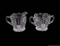 Creamer and sugar pair side by side showing overall design