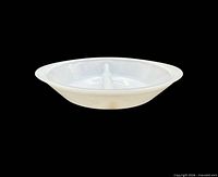 Side view of divided milk glass casserole dish