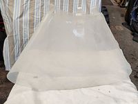 Full view of clear plastic cone laid flat showing overall shape