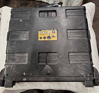 Front view of folded rolling tote showing overall design