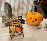 Table view showing fountain, decorative chair and pumpkin