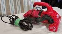 Left side view showing entire Dirt Devil Ultra vacuum with hose, dust bag and cord