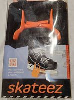 Front of Skateez retail package showing orange stabilizers and product name