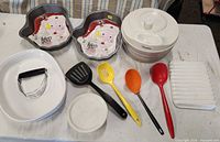 Overview of all items including pans, salad spinner, dish and utensils