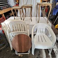 Three plastic side tables, two plastic armchairs, two folding plastic armchairs and round folding wood table overview