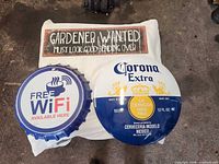 Corona Extra, Free WiFi round signs and Gardener Wanted sign