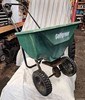 Full view of Golfgreen spreader showing hopper, handle and wheels
