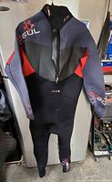 Full view of wetsuit front showing color scheme, zipper, brand graphics