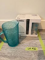 Pitcher beside unopened IKEA Snäll 6-pack box