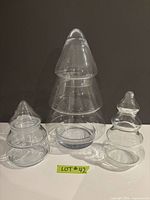 All three clear glass Christmas tree jars front view