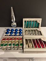 All ornaments and topper grouped on table