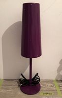 front view of purple table lamp unplugged