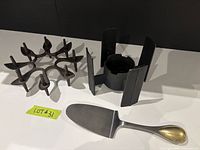 Overall view of candle holder, fondue stand and cake server