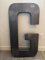 Front view of extra-large metal letter G