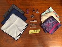 Full lot showing pocket squares, cufflinks and tie clips laid out