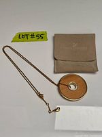 Full view of necklace with pouch