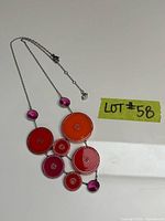 Full view of necklace layout showing discs, chain and clasp