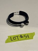 bracelet laid flat showing black and clear crystal ball ends