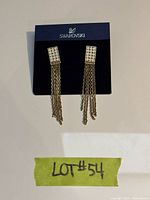 Front view on Swarovski card showing crystal-set rectangles and tassels