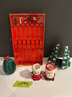 All items group shot showing swizzle stick set, tree napkin holder, Santa & Mrs. Claus holders, holly salt shaker