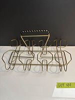 Full view of gold-tone wire glass caddy front angle