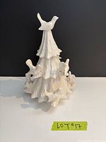 Front view of ceramic tree candle holder showing doves