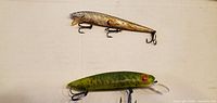 Top view of both lures showing colors, hooks, bill